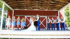 This image shows a wedding ceremony on the barn stage at Trollwood Park.
