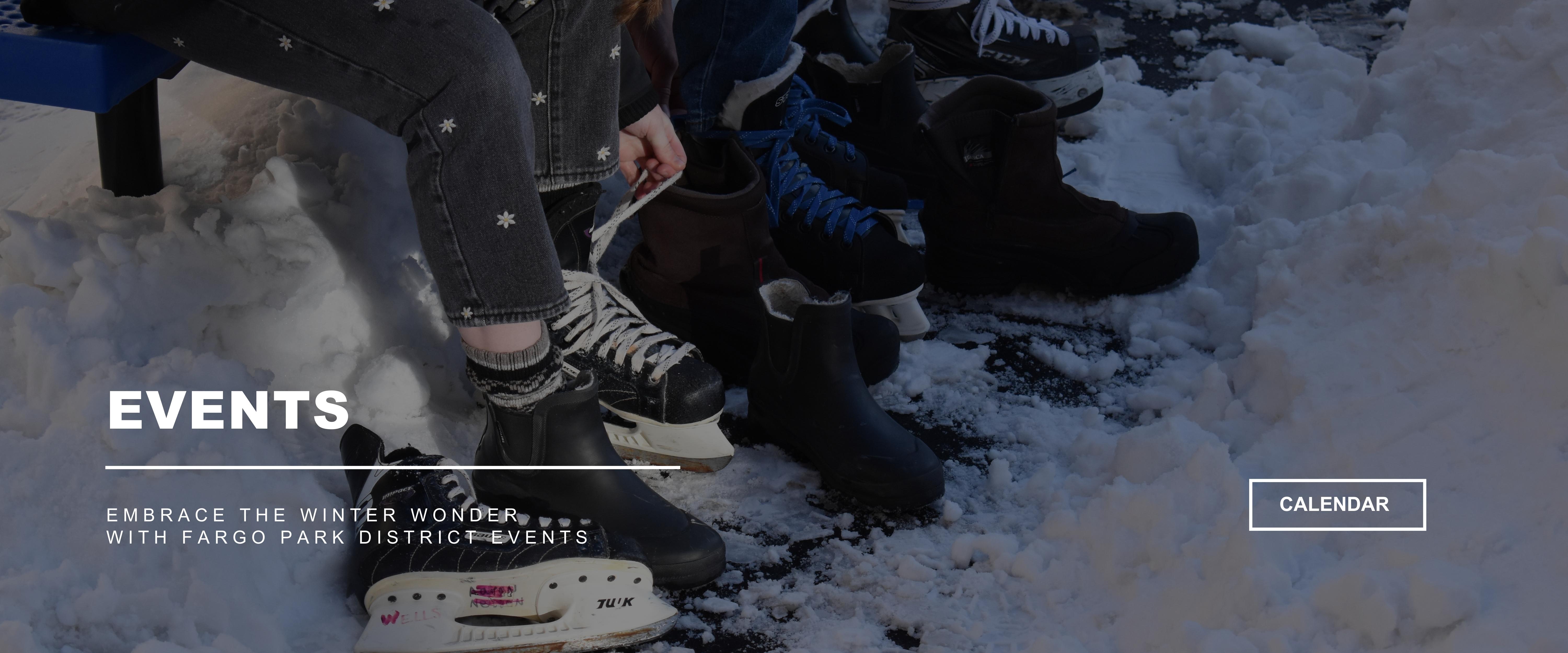 The feet and legs of three people sitting on a blue bench getting their hockey skates on surrounded by snow - EVENTS - Embrace the winter wonder with Fargo Park District Events - CALENDAR button on the right