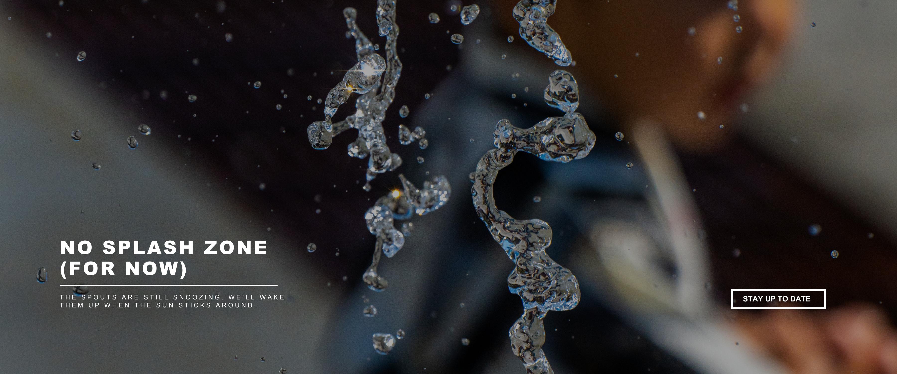 This image is of water splashing at the spouts at broadway square and text saying that they arent open yet for the season with a button to stay up to date