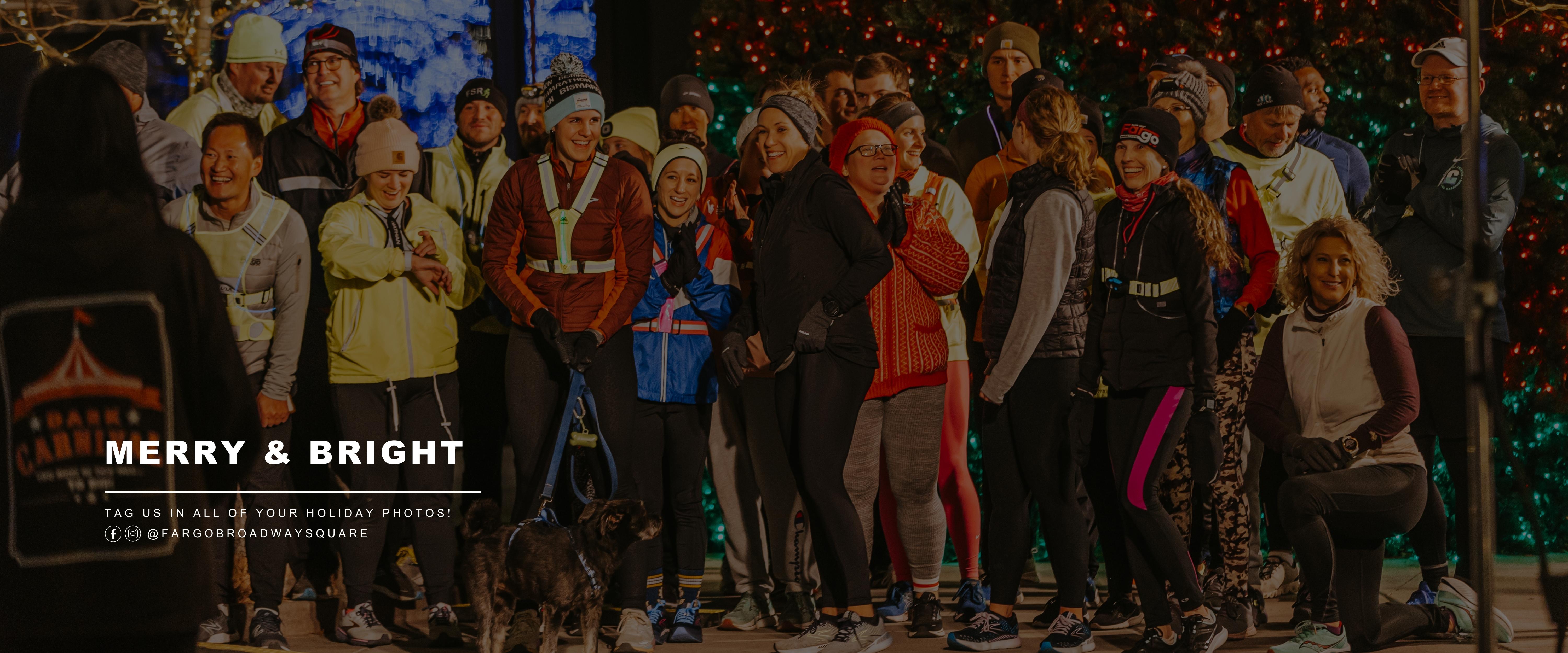 This graphic shows people taking photos at the square with text that says merry and bright