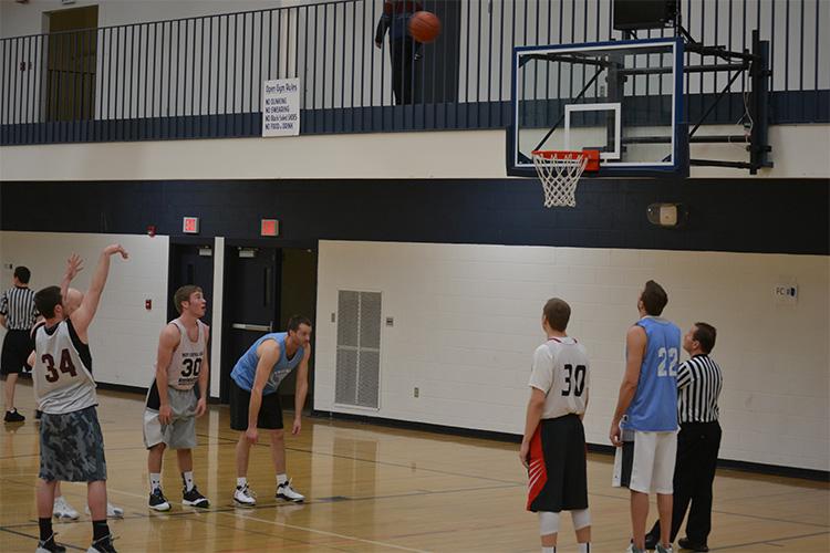 basketballadult This image shows a male shooting free throws at the adult basketball program.
