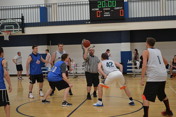 basketballadult This image shows the tip-off at the adult basketball program.