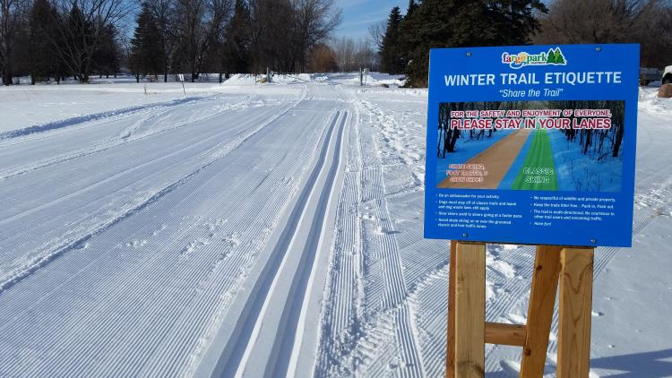 This image shows the cross country ski trail etiquette sign.