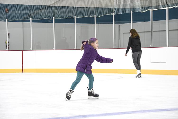 This image shows a girl ice skating.