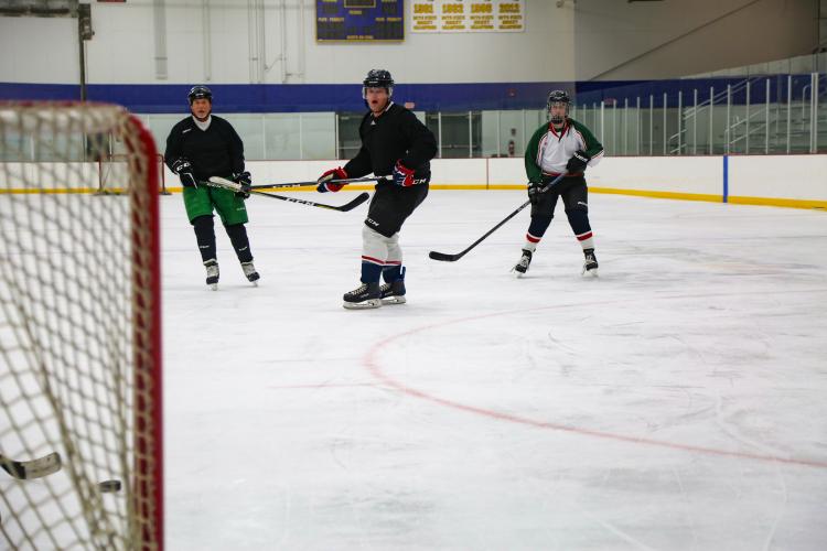 dropinhockey_1 This image shows men skating on the ice at Drop In Hockey.