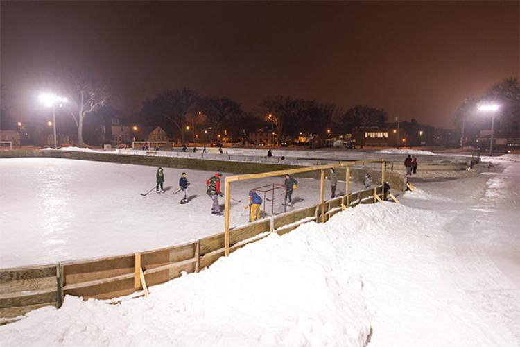 This image shows two outdoor ice rinks with people skating on them.