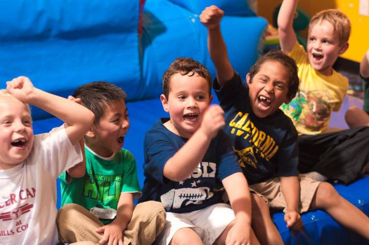 This image shows a group of kids laughing.