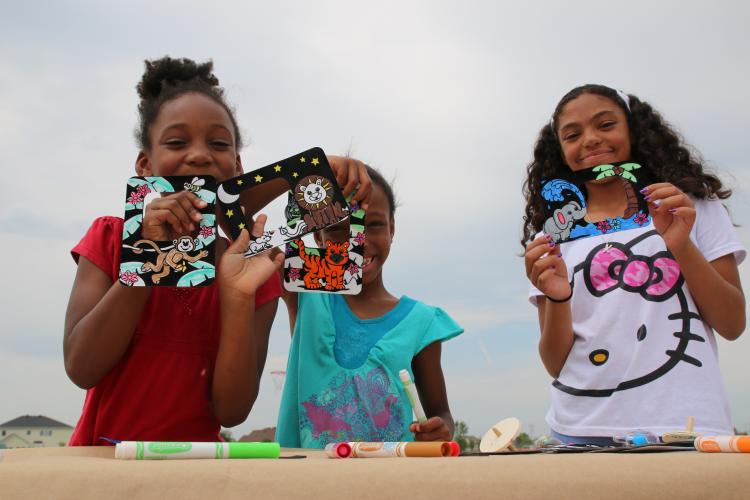 This image shows a group of girls finishing an art project.