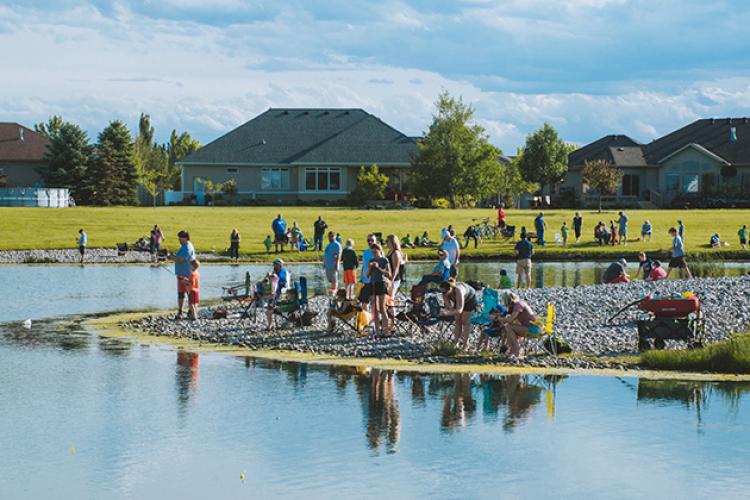 troutfest2 This image shows all the participants around the pond at Trout Fest.