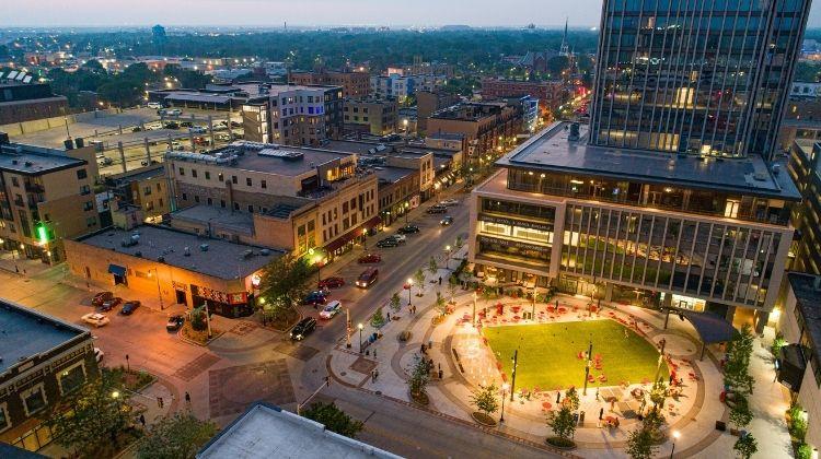 This image shows an aerial view of Broadway Square on a summer night.