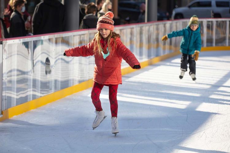 scheelsskatingrinkarticlephoto This image shows a photo of people skating on SCHEELS Skating Rink.