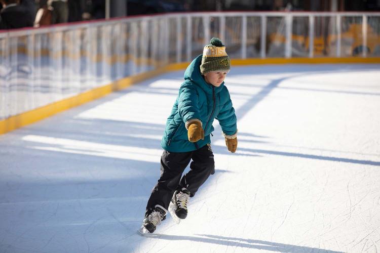 scheelsskatingrinkarticlephoto This image shows a photo of people skating on SCHEELS Skating Rink.