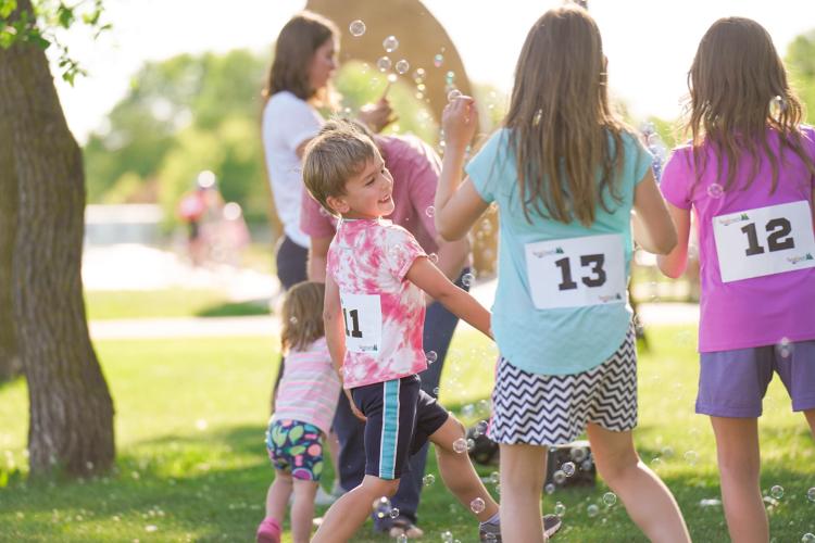 Kid Triathlon - Participants playing with bubbles Kids playing in with bubbles while waiting for next event in Kids Triathlon