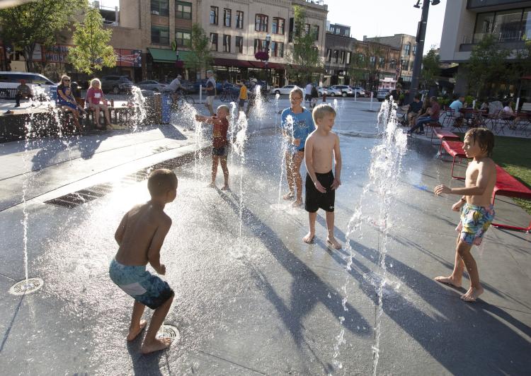 BS- Spout Photo Young children playing at the interactive water fountains