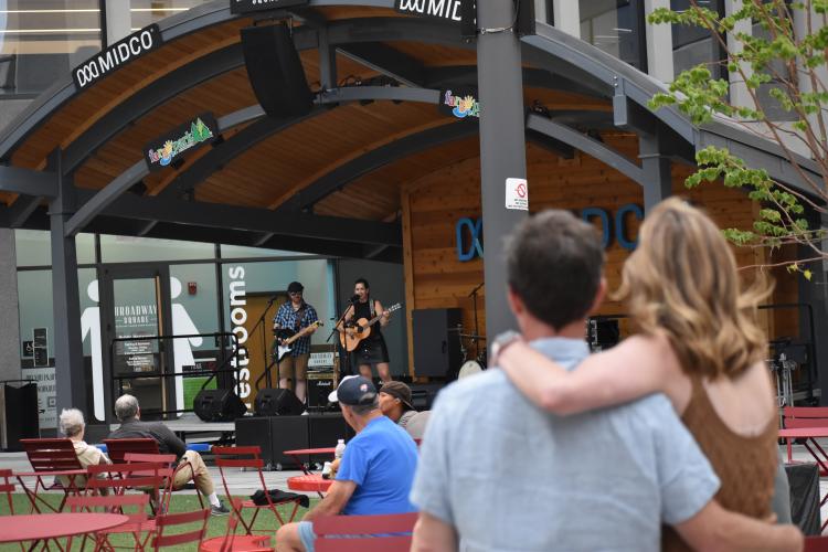 Couple watching music at Broadway Square