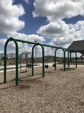 This image shows the swings at Urban Plains Park.
