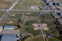 This image shows an aerial view of Tharaldson Baseball Complex.