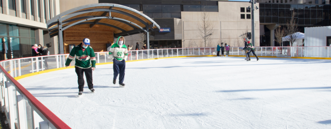 This image shows people skating on the rink at Broadway Square.