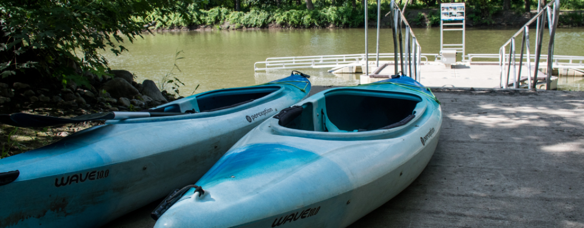 This image shows a photo of a kayak and a kayak launch. 