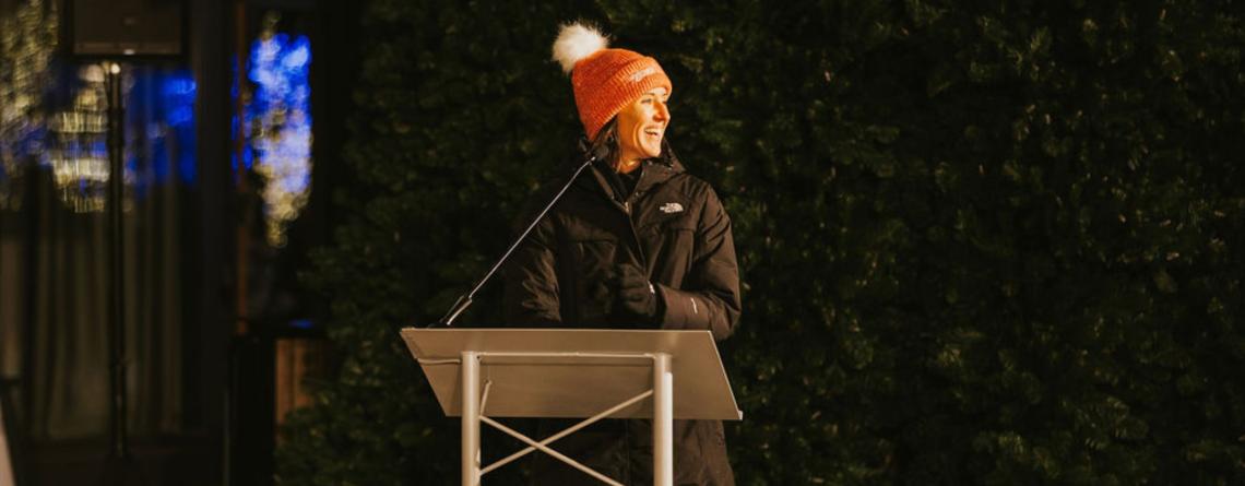 Photo of susan faus speaking at holiday tree lighting event