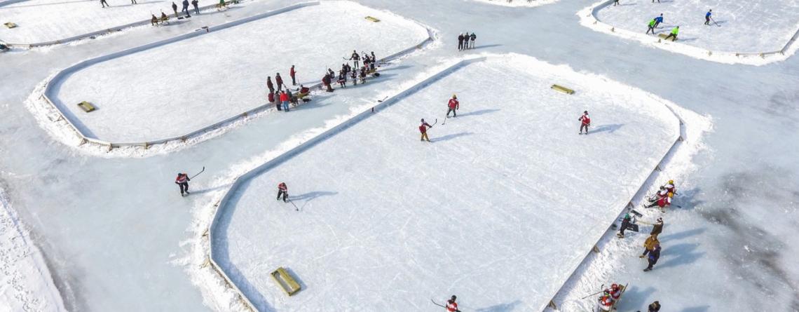 photo of people playing hockey on outdoor rinks