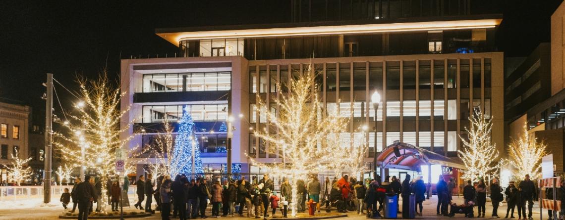 image of people standing around broadway square during winter