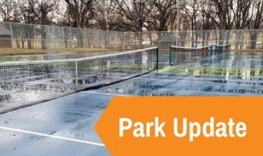 This image shows a tennis courts with nets in place with an orange arrow and text reading Park Update.