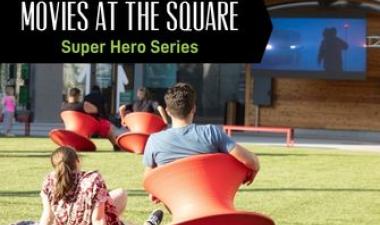 This image shows a graphic of "Movies at The Square Super Hero Series" on top of a photo of people watching a movie on the Midco Mega Screen at Broadway Square.