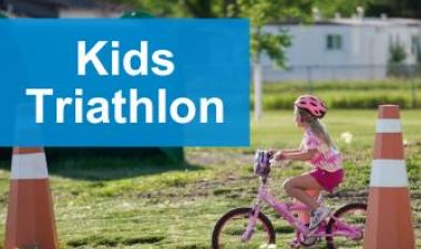 This image shows a graphic of "Kids Triathlon" with a photo of a young girl riding a pink bike and wearing a pink helmet.