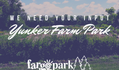 This photo shows the gardens at Yunker Farm Park with the text We need your input Yunker Farm Park and the Fargo Parks logo