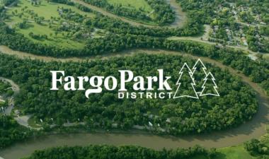 This image shows and aerial view of Island Park with the Fargo Park District new logo on it