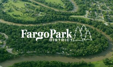 This image shows and aerial view of Island Park with the Fargo Park District new logo on it