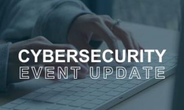 Hands typing on a keyboard with the words - Cybersecurity Event 