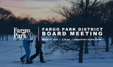Winter sunset with two snowshoers behind fargo parks logo 