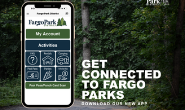 Promotional graphic for the new Fargo Park District app featuring a smartphone displaying app options over a wooded park trail. Text reads, “Get connected to Fargo Parks. Download our new app.”