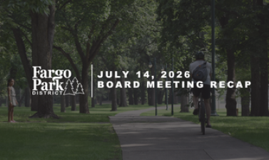 Fargo Park District July 14, 2026 Board Meeting Recap graphic featuring a shaded park pathway lined with mature trees and people walking in the background. 