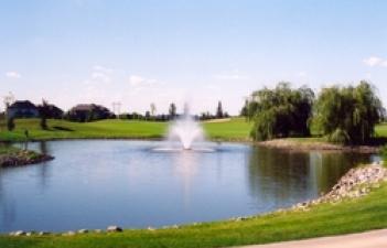 This image shows the pond with a fountain at Rose Creek Public Golf Course.