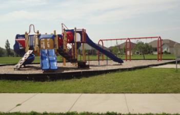 This image shows the playground at Woodhaven North Park.