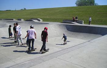 This image shows a group of skateboarders at the skate park.