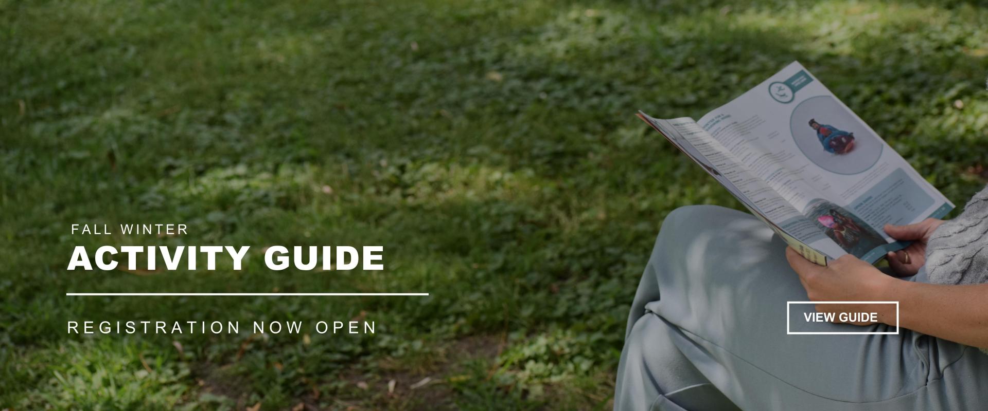 Person sitting reading the Fall-Winter Activity Guide - Fall-Winter Activity Guide - Registration Now Open