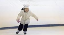 This image shows a young girl skating at Open Skate.