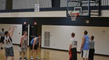 This image shows a male shooting free throws at the adult basketball program.