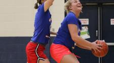 This image shows two females at the adult basketball program.