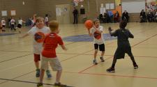 This image shows young children on the court at the youth basketball program.