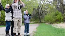 Photo shows family birding.