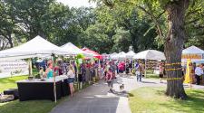 This image shows multiple vendor tents at Island Park Show.