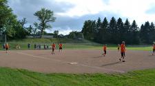 This image shows players on the entire field during kickball league.