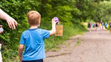 This image shows a boy finding an egg on the walk during Monstrous Imaginaton.