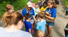 This image shows the instructor teaching kids about the egg they found on a walk during Monstrous Imagination.