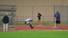 This image shows a male long jumping at the North Dakota Senior Games.